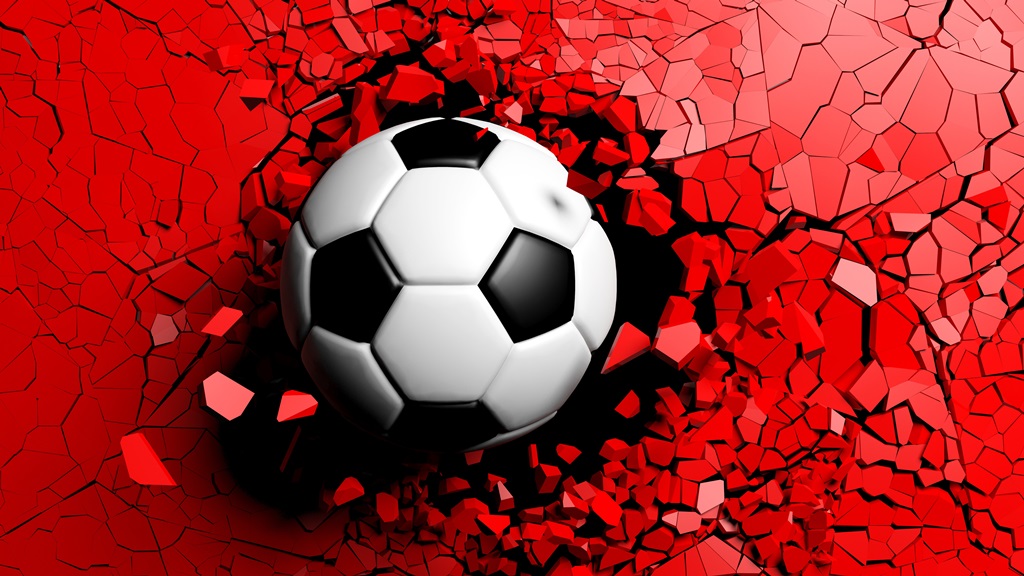 Фотообои Футбольный мяч с силой пробивает красную стену